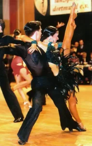 dance couple at a competition high kick